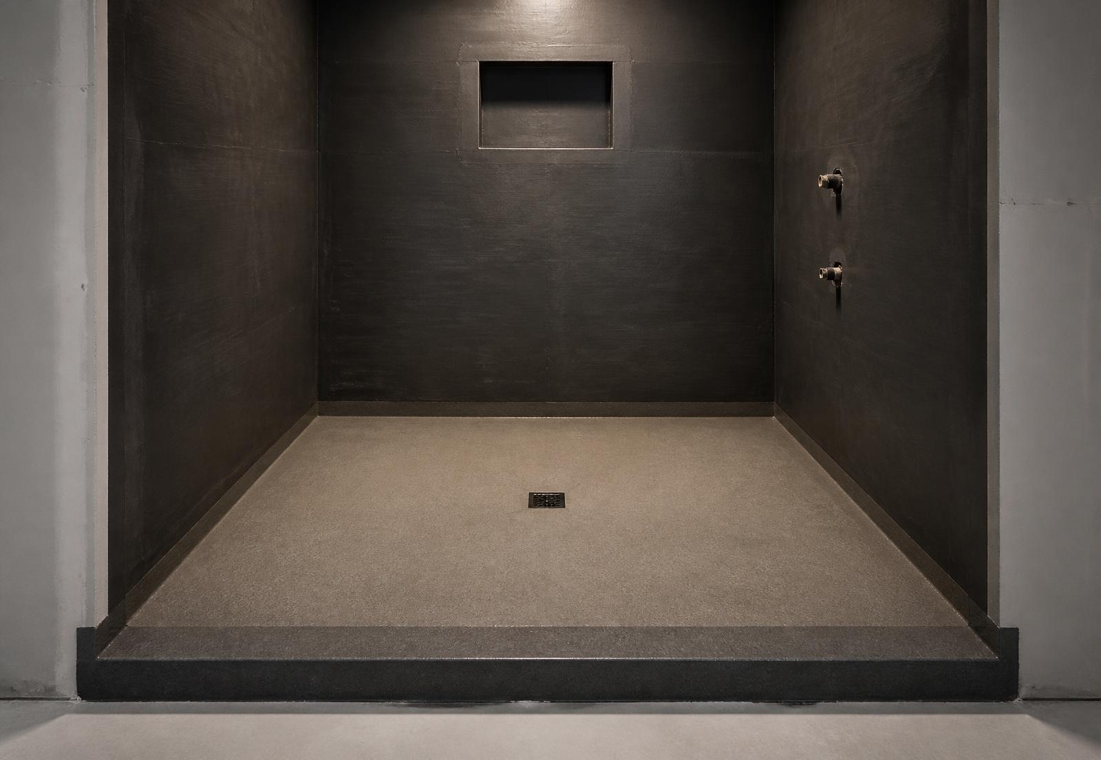 Finished shower base with drypack mortar sloped evenly toward a centre drain
